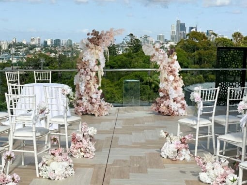 wedding ceremony pink white asymmetrical arch